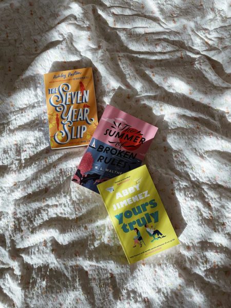3 books on a bed