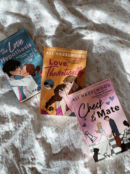 3 books on a bed