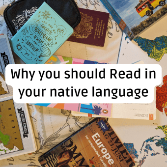 A diverse, top-down collection of travel and reading items, including a light blue diary with adventure icons and the text 'You Are My Greatest Adventure,' a UK passport, a travel guide for 'Europe for independent travellers,' a stylized world map, and a text overlay box with the title: 'Why you should Read in your native language'.
